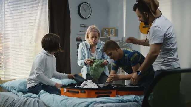 Family Packing For A Holiday: Stock Video
