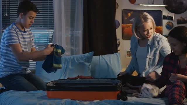 Mother And Kids Packing: Stock Video