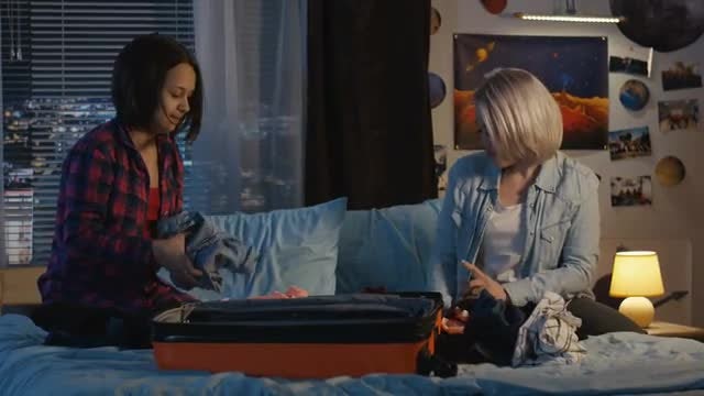 Mother Helping Daughter pack: Stock Video