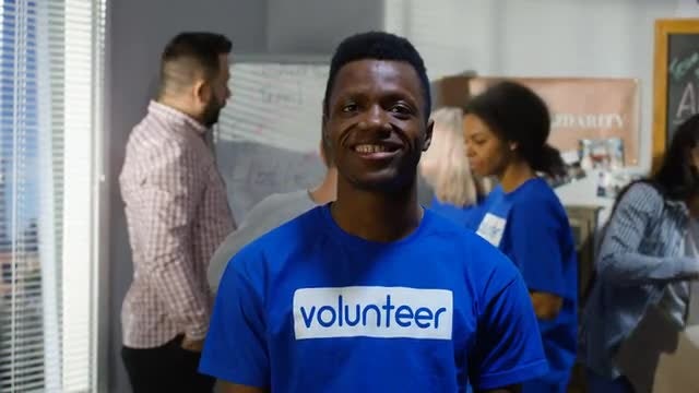 Man Volunteers At Charity: Stock Video