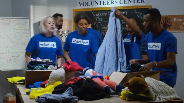 Volunteers Pack Donations: Stock Video