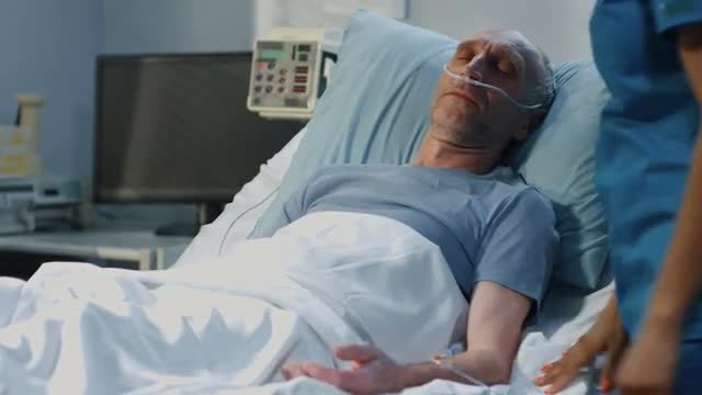 Nurses Checking On Patient: Stock Video
