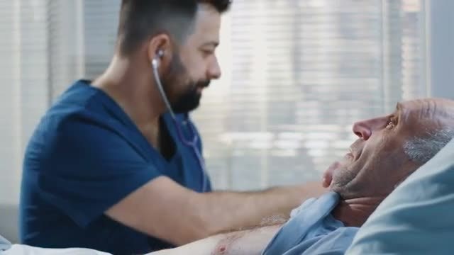 Doctor Using Stethoscope: Stock Video