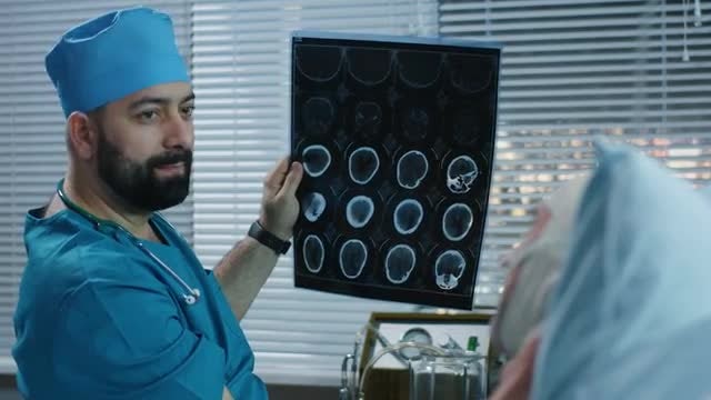 Doctor Showing Brain Scans: Stock Video