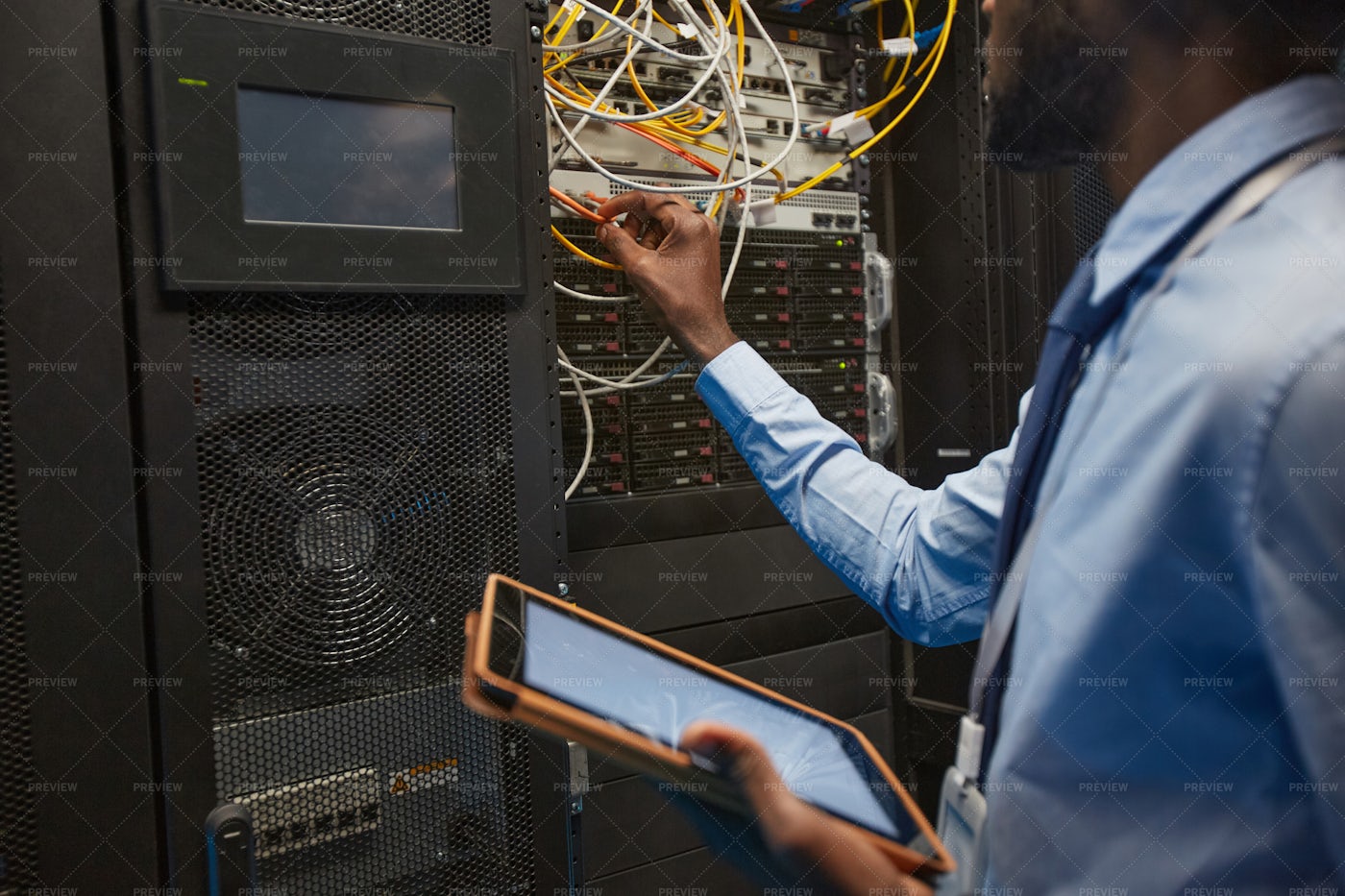 Network Engineer In A Server Room: Stock Photos