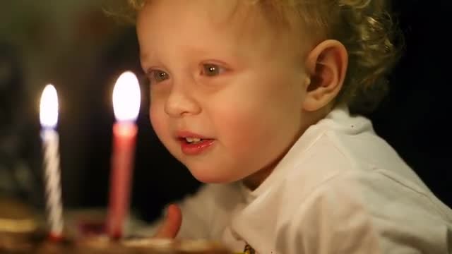 Little Boy Blowing Candles: Stock Video