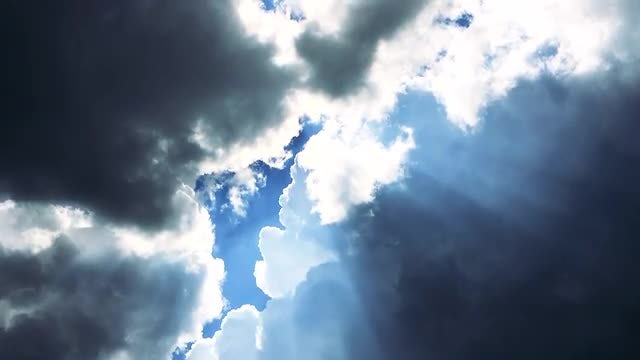 Sunlight Peeking Behind The Clouds: Stock Video