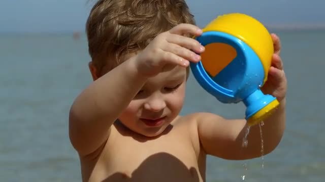 Boy With Beach Toy: Stock Video