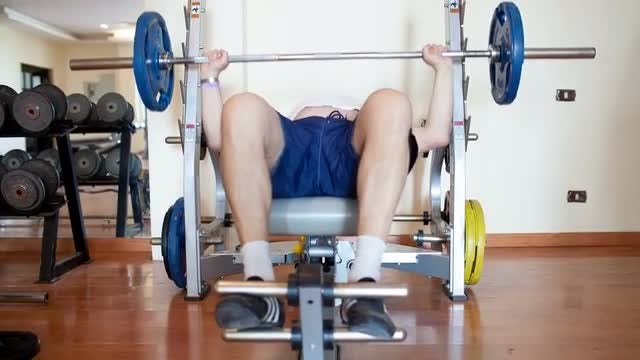 Man Lifting Weights At Home: Stock Video