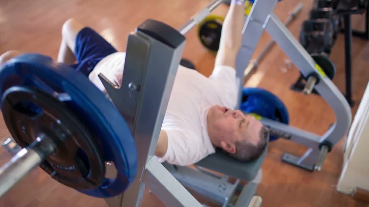 Man Lifting Bench Press Bar Stock Video Motion Array