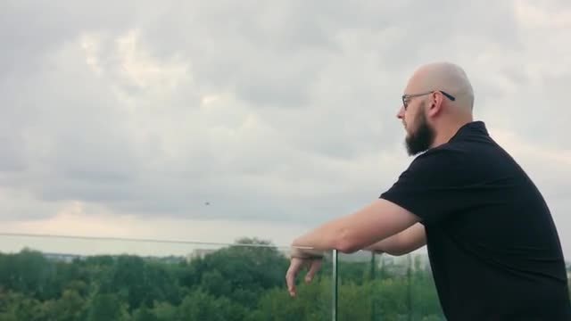 Man On Balcony Admiring Nature: Stock Video