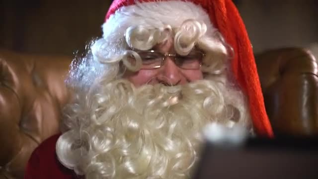 Modern Santa Claus Using iPad: Stock Video