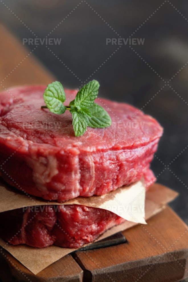 Beef raw meat cubes for stew on wooden cutting board Stock Photo by  its_al_dente