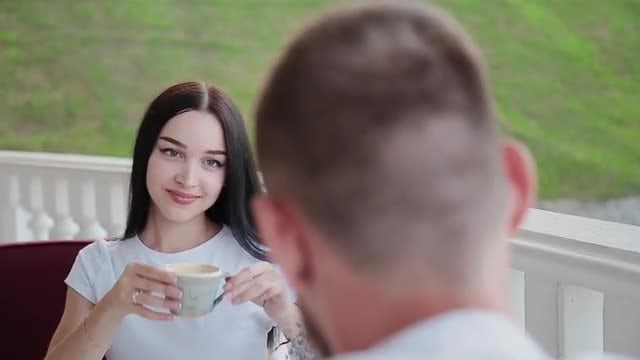 Couple Drinking Coffee In Cafe: Stock Video