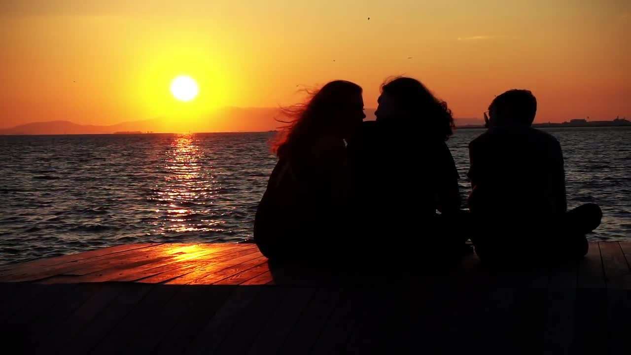 Sitting On Dock During Sunset - Stock Video | Motion Array