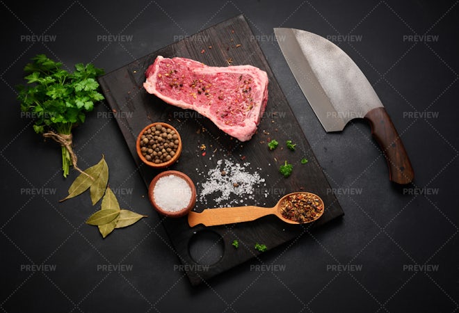 Beef raw meat cubes for stew on wooden cutting board Stock Photo by  its_al_dente