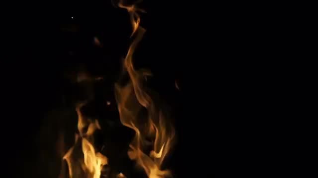 Yellow Flames Against Black Background: Stock Video