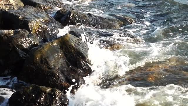 Ocean Waves Crashing Into Rocks: Stock Video