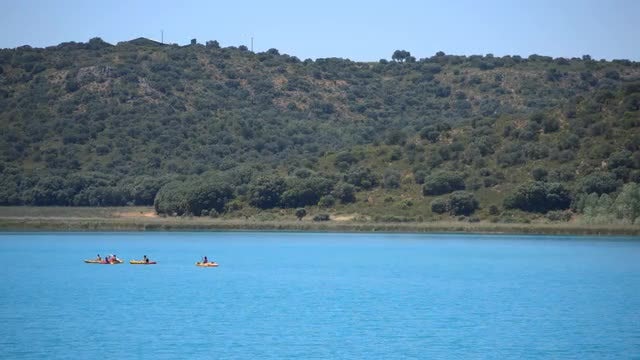 Kayaks On Blue, Picturesque Lake: Stock Video