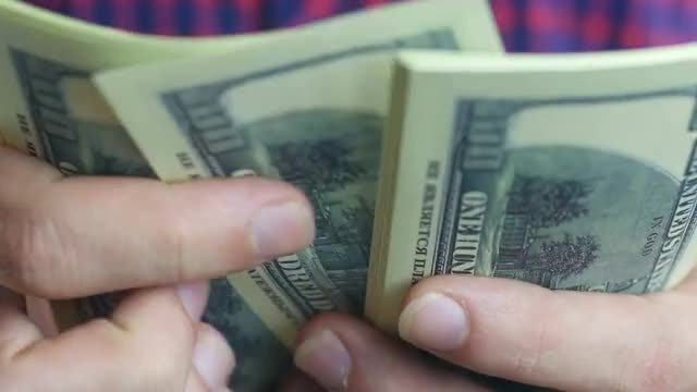 Man Shuffling Hundred-Dollar Bills: Stock Video