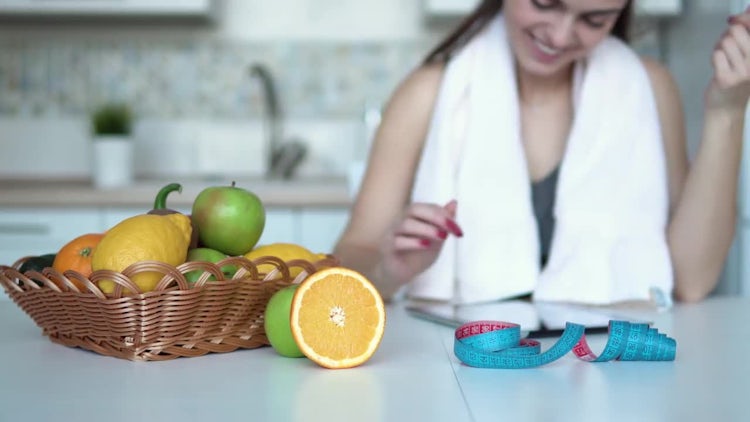 Woman Using Tablet In Kitchen: Stock Video