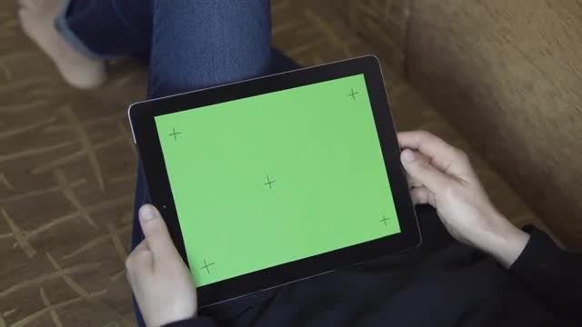 Girl On Sofa Uses Tablet: Stock Video