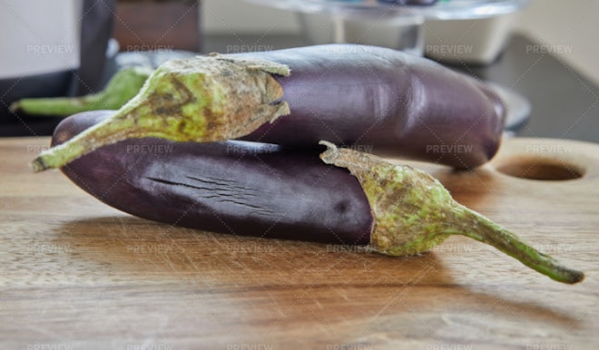 Premium Photo  Cook cuts the eggplant according to the recipe, on