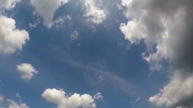 White Fluffy Clowds Over Blue Sky: Stock Video