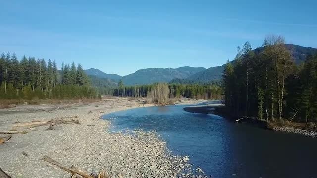 Following The Mountain River: Stock Video