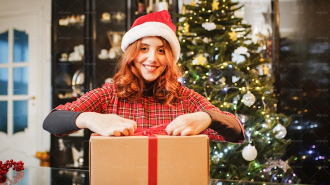 Girl Opening Her Christmas Gift - Stock Photos | Motion Array