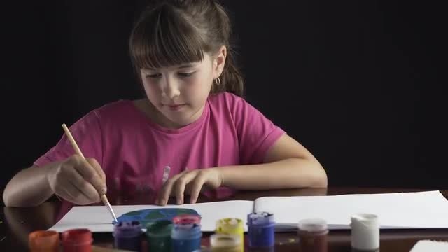 Girl Painting Planet Earth: Stock Video