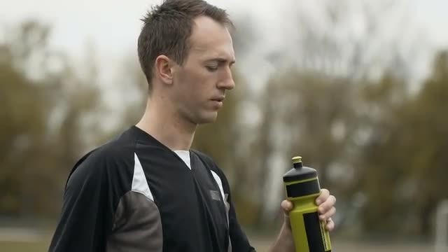 Jogger Drinking Water From Bottle: Stock Video