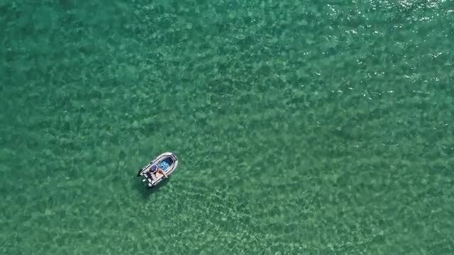 Man On Sea Using Inflatable: Stock Video