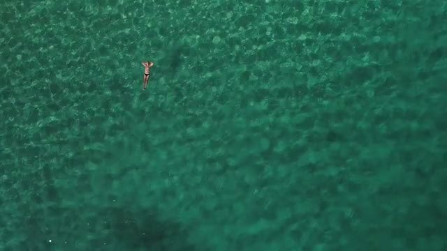 Man Float On Clear Sea: Stock Video
