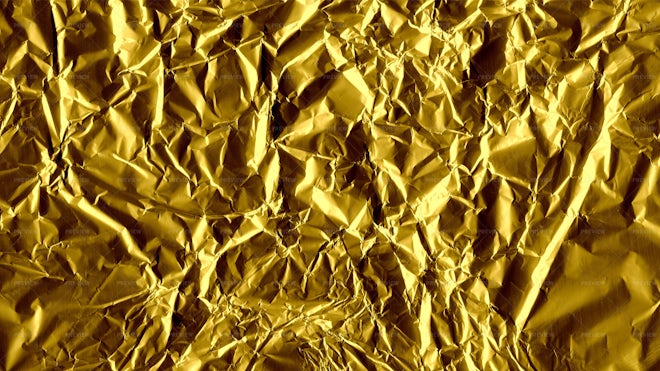 Gold crumpled aluminum foil texture