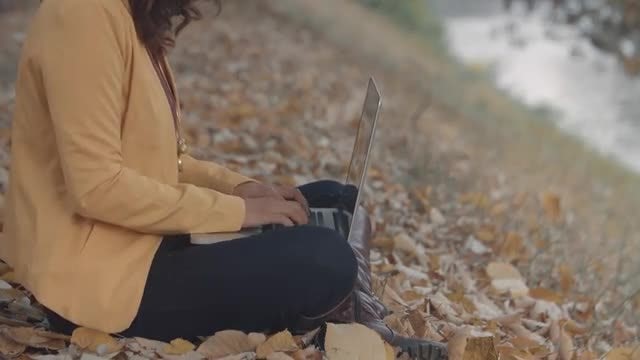 Girl Tying On A Laptop: Stock Video