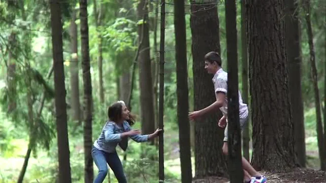 Teens Playing In Woods - Stock Video | Motion Array