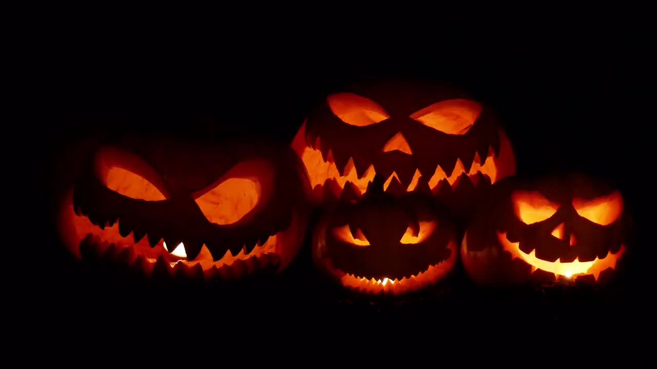 Scary Pumpkins Flickering In The Night - Stock Video | Motion Array