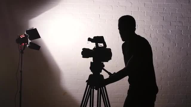 Cameraman Working In Film Studio: Stock Video