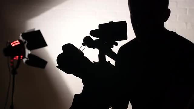 Cameraman Working In Film Studio: Stock Video
