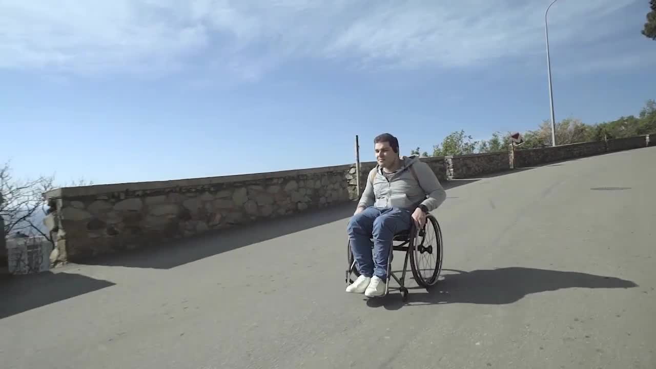 Man Rolling Down Coastal Road - Stock Video | Motion Array