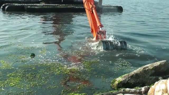 Garbage Excavator In The Sea: Stock Video