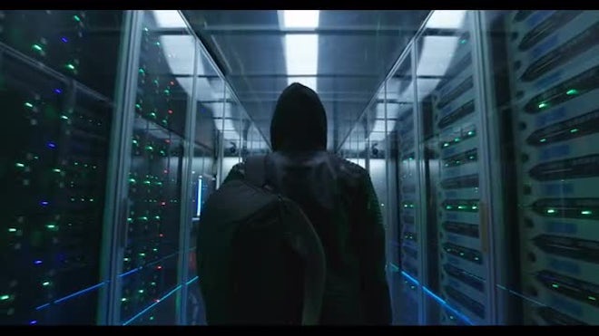 Hacker In The Server Room - Stock Video | Motion Array