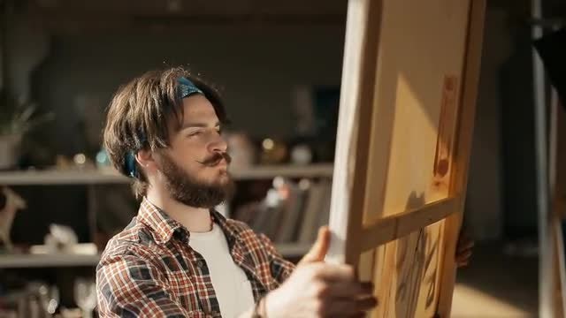 Artist Looks At Canvas: Stock Video
