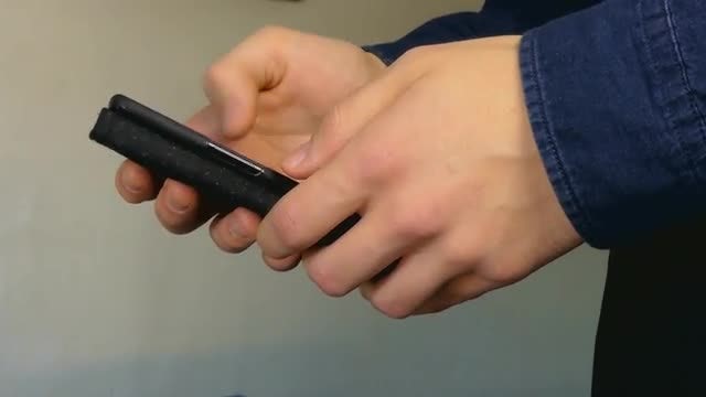 Man Using A Smartphone Indoors: Stock Video