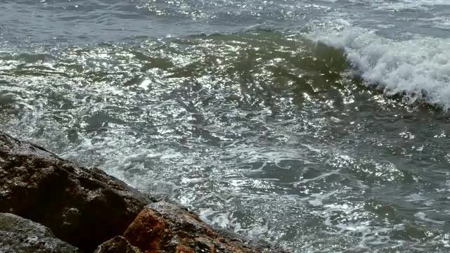 Waves Crashing Into Wave Breaker: Stock Video