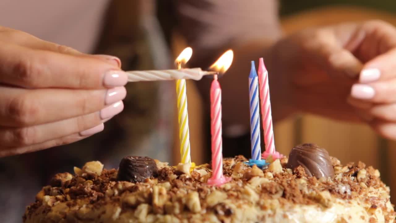 Woman Lighting Up Birthday Candles Stock Video Motion Array