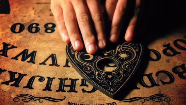 Person Uses An Ouija Board: Stock Video
