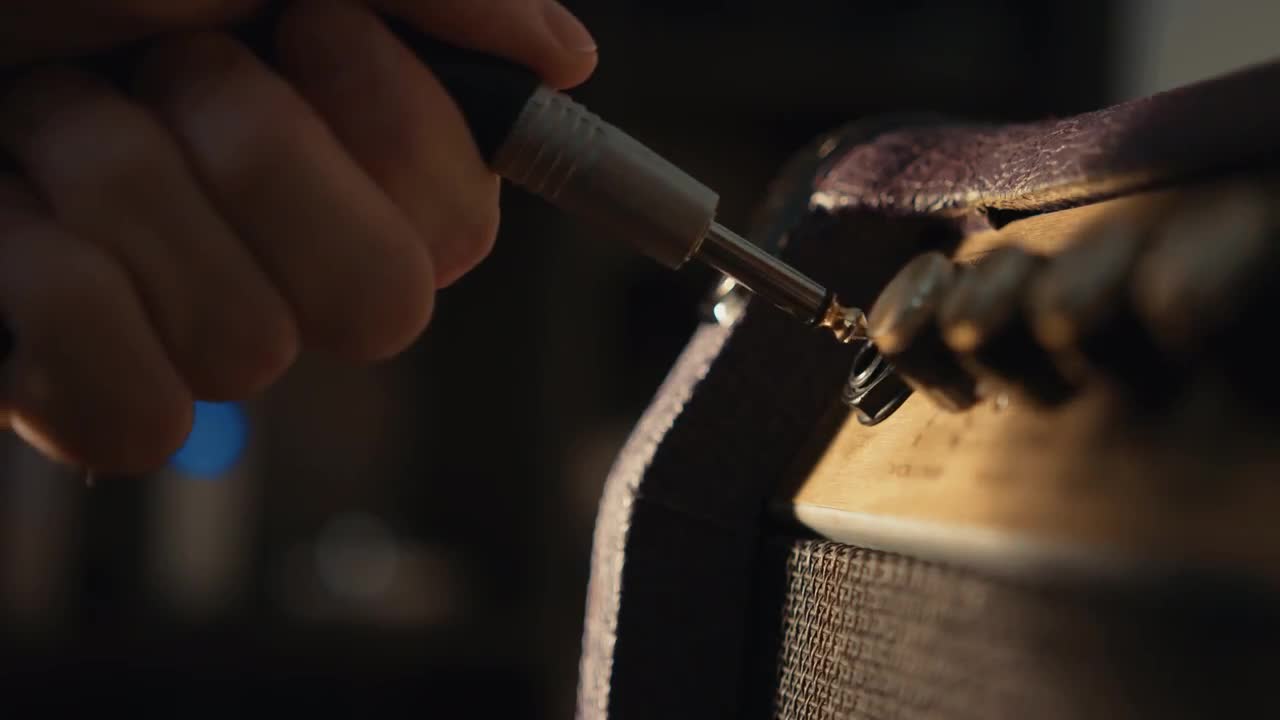 Plugging Electric Guitar Into Amp Stock Video Motion Array