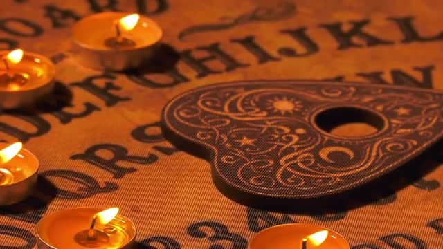 Ouija Spirit Board Spinning Slowly: Stock Video